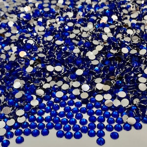 Resin Rhinestones in Sapphire. Non-Hotfix, Flat Back, Foil Backing. Available in 2mm, 3mm, 4mm and 5mm