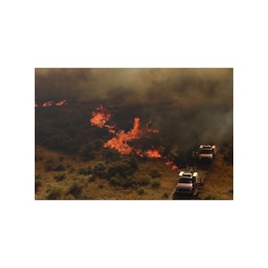 Wild Land Fire Print | Firefighters battle a wildfire near Portage, Utah, Aug. 12, 2013.