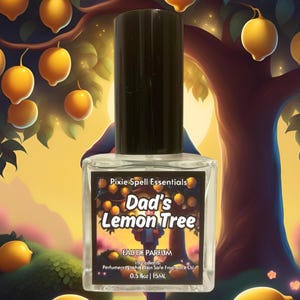 May include: A clear glass perfume bottle with a black cap, labelled "Dad's Lemon Tree" by Pixie Spell Essentials. The label features a colourful illustration of a lemon tree. The bottle contains 15ml of Eau de Parfum.