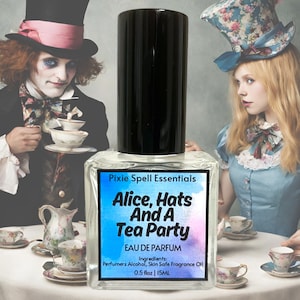 May include: A clear glass bottle with a black cap and a blue label that reads "Pixie Spell Essentials Alice, Hats And A Tea Party Eau De Parfum Ingredients: Perfumers Alcohol, Skin Safe Fragrance Oil 0.5 floz | 15ML".