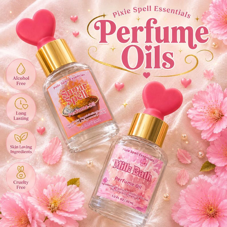 May include: Two clear glass perfume oil bottles with gold caps and pink heart-shaped toppers. One label reads Sugar Spell Perfume Oil 0.5 fl oz 15 ml, the other Milk Bath Perfume Oil 1.0 fl oz 30 ml. Text includes Pixie Spell Essentials Perfume Oils.
