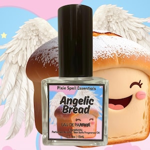 May include: A perfume bottle with a black cap and a label that reads "Angelic Bread" with a cartoon bread illustration. The background features cartoon bread with angel wings and a blue and pink sky. The bottle contains 15ml of perfume.