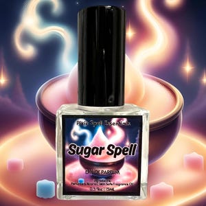 May include: A clear glass bottle of Sugar Spell Eau de Parfum by Pixie Spell Essentials. The bottle is labeled with a pink and purple design and the text "Sugar Spell". The bottle is 0.5 fl oz or 15 ml.