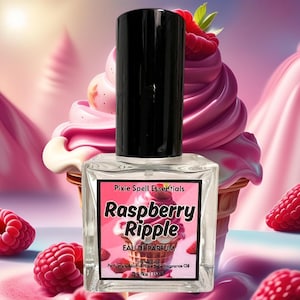 May include: A clear glass bottle of Raspberry Ripple Eau de Parfum by Pixie Spell Essentials. The bottle is labeled with a pink and white illustration of a raspberry ice cream cone. The bottle is 0.5 fl oz (15 ml).