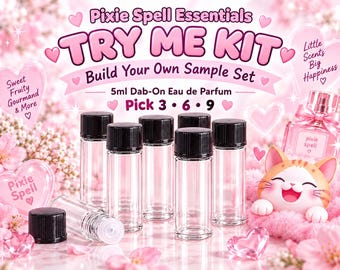 May include: A Pixie Spell Essentials Try Me Kit featuring six clear 5ml dab-on eau de parfum glass vials with black screw caps. The display includes text reading Pixie Spell Essentials, Try Me Kit, Build Your Own Sample Set, and Pick 3 6 9.