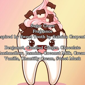 May include: A cartoon tooth design with pink frosting and chocolate squares, labeled "Sugar Crave Fragrance." The fragrance is inspired by Sweet Tooth by Sabrina Carpenter, with notes of bergamot, candied ginger, chocolate, and more.