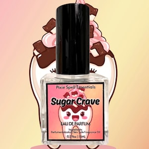 May include: A clear glass perfume bottle with a black cap. The label reads "Sugar Crave" with a cartoon ice cream design. The bottle contains 0.5 fl oz or 15 ml of perfume. The background features a cartoon ice cream sundae.