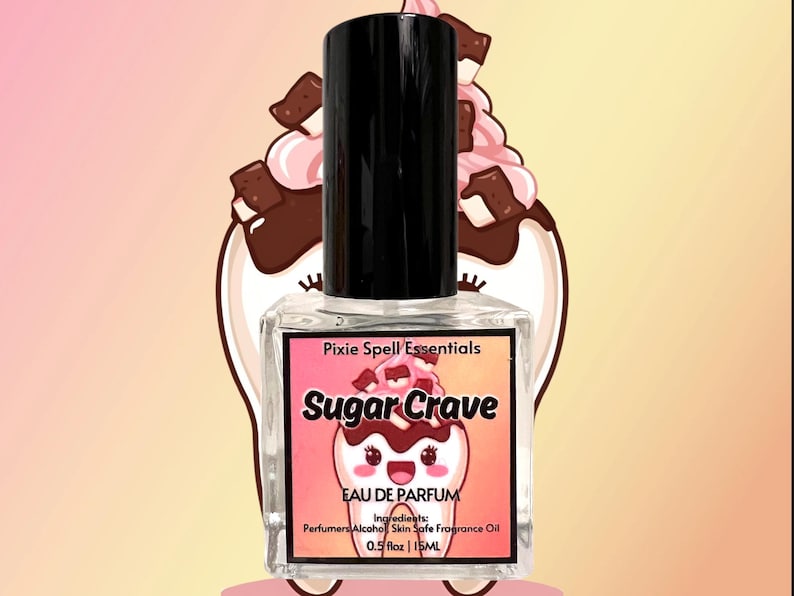 May include: A clear glass perfume bottle with a black cap. The label reads "Sugar Crave" with a cartoon ice cream design. The bottle contains 0.5 fl oz or 15 ml of perfume. The background features a cartoon ice cream sundae.