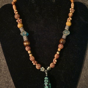 Bohemian wooden beaded necklace with blue czech glass flower accent charm
