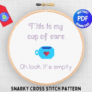 May include: A cross stitch pattern with the text "This is my cup of care. Oh look it's empty." and a pixelated image of a blue cup with a red heart. The pattern is labeled "Snarky Cross Stitch Pattern".