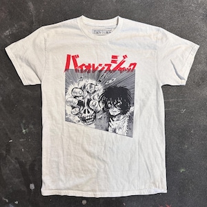May include: White t-shirt with a black and white graphic print of a character from the anime "Berserk". The character is holding a skull in their hand. The text "Berserk" is printed in red above the graphic.