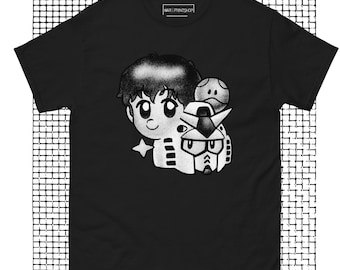Op de afbeelding: Zwart-wit T-shirt met een grafische print van een cartoonfiguur met een robot en een klein rond object. De tekst "WAREPRINT SHOP" is op het shirt gedrukt.