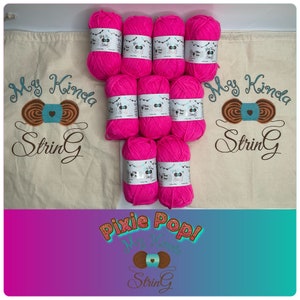 May include: A set of ten pink yarn skeins with the text "My Kinda String" and "Pixie Pop!" on the labels. The yarn is packaged in two white canvas bags with the text "My Kinda String" printed on them.
