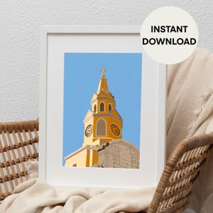 May include: A framed print featuring a yellow church steeple with a clock and cross against a blue sky. The words "INSTANT DOWNLOAD" are in a white circle in the upper right corner. The print is displayed on a white background.