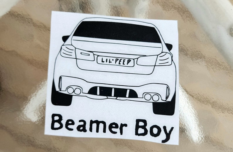 May include: Black and white line drawing of a car with the text "Lil Peep" on the number plate and the text "Beamer Boy" below the car.