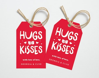 May include: Two red gift tags with white text that reads "Hugs and Kisses" with lots of love, Georgia & Clive.