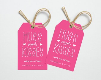May include: Two vibrant pink gift tags with white script reading "HUGS and KISSES". Each tag features a jute twine string and the text "with lots of love, GEORGIA & CLIVE".