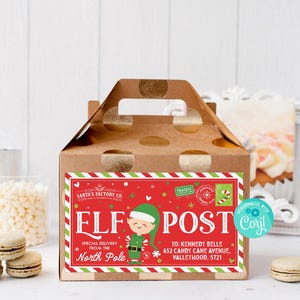 May include: A brown cardboard gift box with a handle, featuring a red and green label that reads "ELF POST" with an illustration of an elf. The label also includes the text "Special Delivery From The North Pole."
