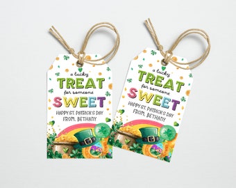 May include: Two green, white, and gold St. Patrick's Day gift tags with a pot of gold, a leprechaun hat, and a rainbow. The text on the tags reads "a lucky treat for someone sweet. Happy St. Patrick's Day from Bethany."
