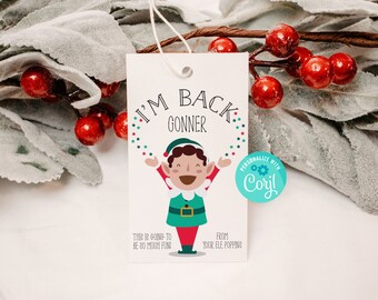 May include: A white gift tag featuring a cartoon elf illustration and the text "I'm Back Gonner" and "This is going to be so much fun!" The tag also includes a blue circle with the text "Personalize with Coril" and "From your elf, popping".