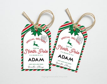 May include: Two red and green striped gift tags with a white background. The tags have a reindeer, a bow, and the text "Special Delivery from the North Pole". The tags are personalized with the name "Adam" and the text "Sent with love from Santa Claus".