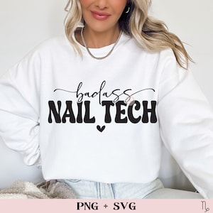 May include: White sweatshirt with the text "badass nail tech" in black with a small heart below the text.  The text is in a retro font style.