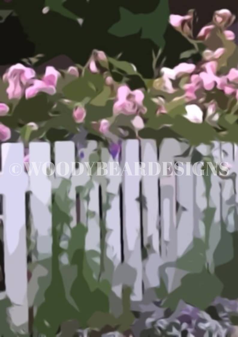 May include: A white picket fence with pink flowers growing over the top. The fence is made of vertical wooden slats and is painted white. The flowers are in full bloom and are a light pink colour. The fence is surrounded by green foliage.