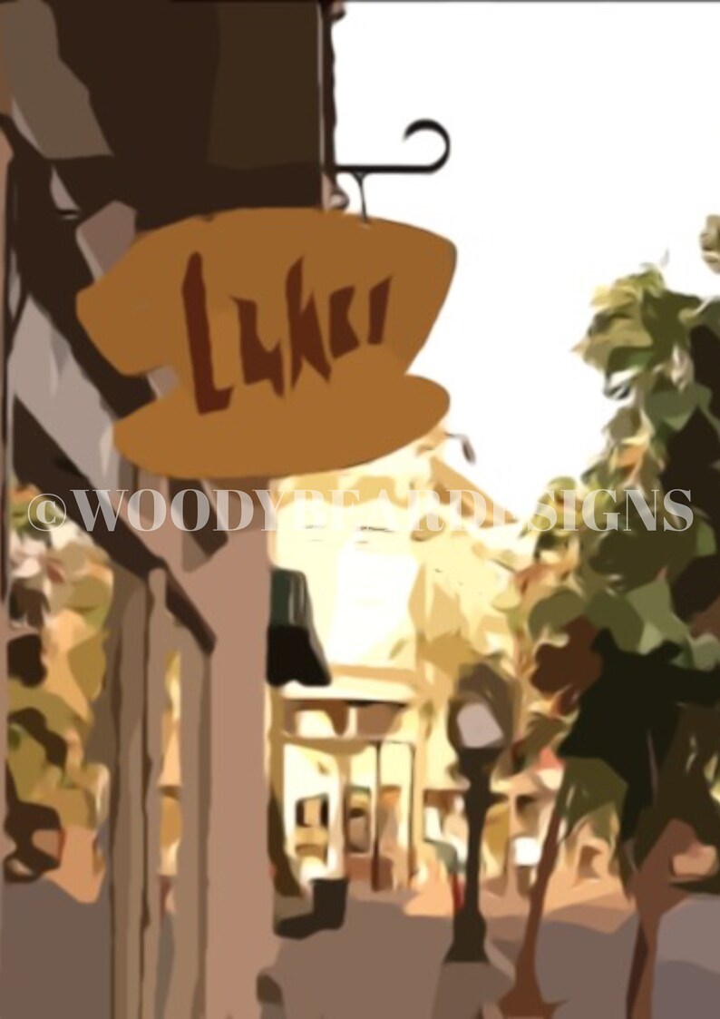 May include: A yellow sign with the word "Luki" on it hangs above a street in a city. The sign is attached to a building with a brown facade. The street is lined with buildings and trees.