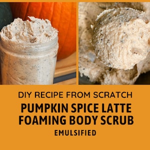 May include: A close-up of a creamy, brown pumpkin spice latte foaming body scrub in a glass jar. The scrub is made from scratch and is emulsified. The jar is sitting on a wooden surface with a pumpkin in the background.