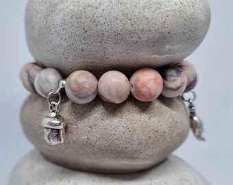 Bracelet Gemstone Pink Zebra Jasper with different charms.