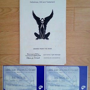 May include: A concert program titled "Defixiones, Will and Testament" with a black winged figure illustration. Two blue tickets for the Royal Festival Hall concert on October 17, 2003, are also visible.