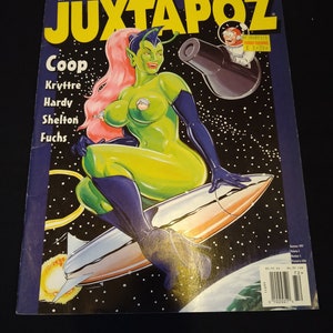 Op de afbeelding: Een vintage Juxtapoz magazine cover met een illustratie van een buitenaardse vrouw op een raket in de ruimte. De cover heeft een gele titel en toont een groenhuidige vrouw met roze haar. Het tijdschrift vermeldt ook de namen van kunstenaars.