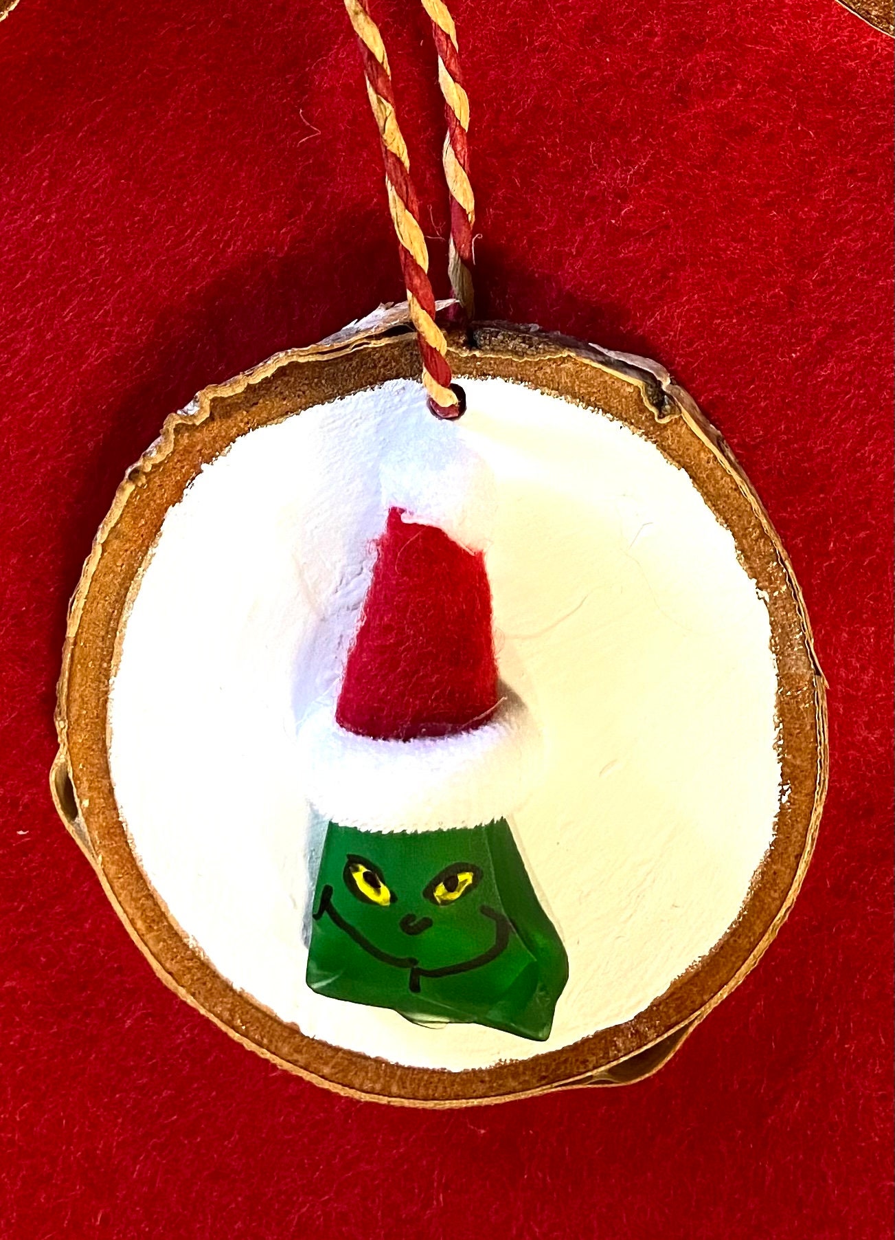 grinch hand holding ornament garden glove｜TikTok Search