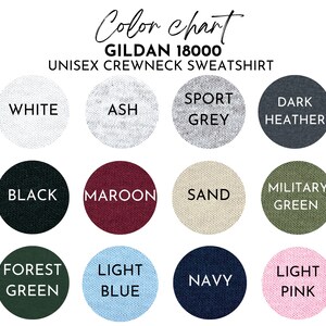 May include: Color chart for Gildan 18000 unisex crewneck sweatshirts. The chart shows 14 different colors, including white, black, maroon, sand, military green, forest green, light blue, navy, and light pink.