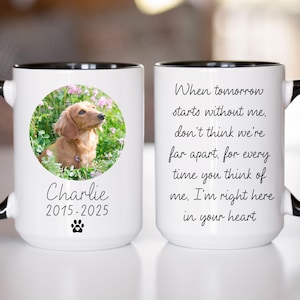 May include: White ceramic mug with a black rim and handle. The mug features a photo of a dachshund in a field of flowers. The text "Charlie 2015-2025" is printed below the photo. The other side of the mug has the text "When tomorrow starts without me, don't think we're far apart, for every time you think of me. I'm right here in your heart."