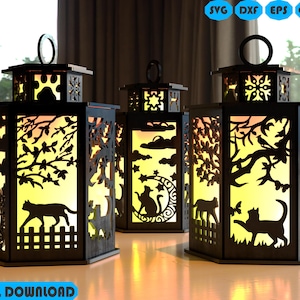 Puede incluir: Tres faroles de madera negra con intrincados recortes con temática de gatos. Cada farol presenta un diseño diferente, incluyendo gatos, árboles y nubes. Los faroles están iluminados desde dentro, creando un brillo cálido. El texto "DIGITAL DOWNLOAD" está en la parte inferior.