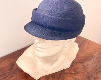 Michael Chanda: blue cap with visor in straw texture