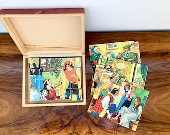 Block puzzle: wooden blocks in a box, Grimm's fairy tales