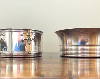 Two silver-plated bottle holders, damaged on the inside