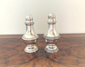 Christofle, collection Gallia: two almost identical silver-plated (powdered) sugar shakers