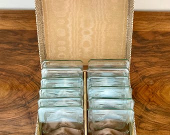 A set of 12 cut glass coasters in a presentation box, 1940s/50s.