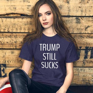 Trump still sucks t shirt, anti-Trump tee, politics, political, democrat, democracy, Unisex t-shirt