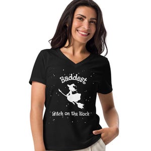 Baddest Witch on the block t shirt, Halloween tee, flying witch on a broom, witches, Women’s relaxed v-neck t-shirt