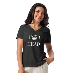 May include: A dark heather grey V-neck t-shirt with a white graphic of a coffee pot and the text "POT HEAD".