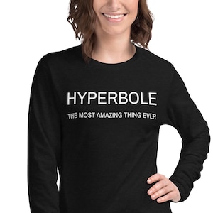 May include: Black long-sleeve shirt with white text that reads "HYPERBOLE THE MOST AMAZING THING EVER".