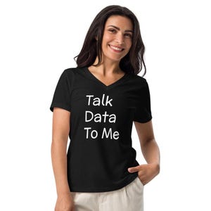 May include: Black v-neck t-shirt with the white text "Talk Data To Me". The shirt is made of a soft material.