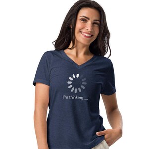 May include: Navy blue V-neck t-shirt featuring a white loading circle graphic and the text "I'm thinking.....". The shirt is made of a soft material.