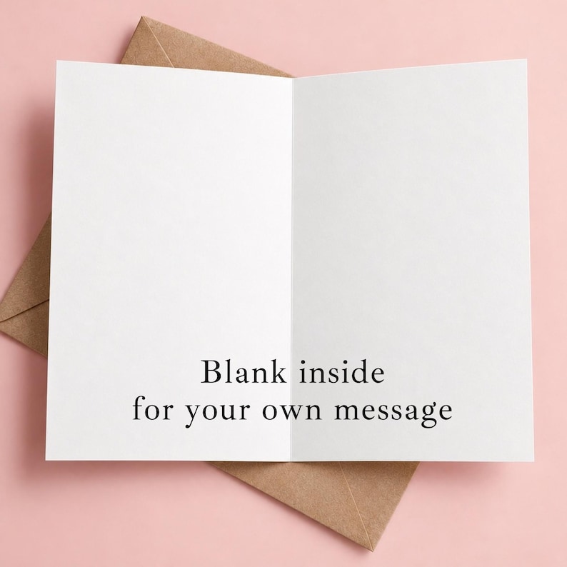May include: A white greeting card with a fold in the center, featuring the black printed text "Blank inside for your own message" on the bottom half of the interior. The card is positioned partially inside a brown kraft paper envelope.