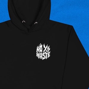 May include: Black hooded sweatshirt with a white graphic print of the words "NO X WASTE" in a stylized font.