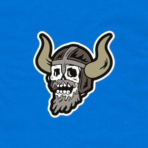 May include: A cartoon illustration of a skull wearing a horned helmet and a beard. The skull is grinning with its teeth showing. The helmet is brown and the horns are white.